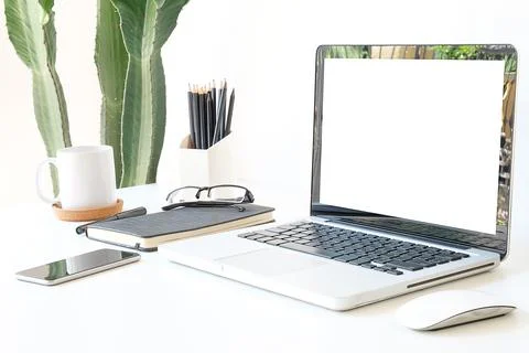 Office desk Work space stuff with notepad, laptop and coffee cup mouse notepa Stock Photos