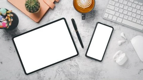 Office desk workplace with blank screen tablet and smartphone, keyboard, mo.. Stock Photos