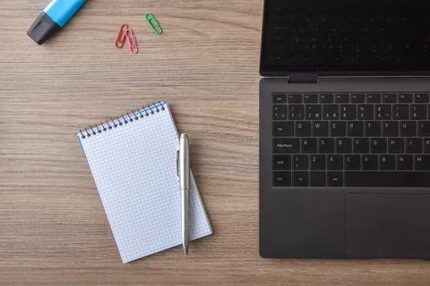 Office Desk Workspace with Notebook and Laptop Stock Photos