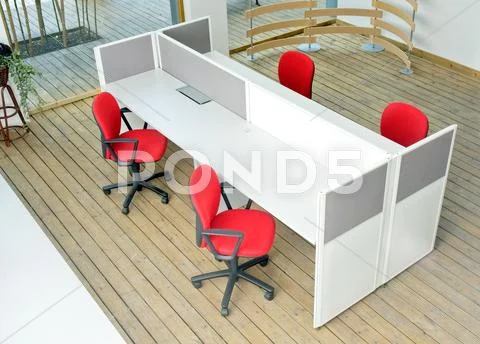 Office desks and red chairs cubicle set Stock Photos