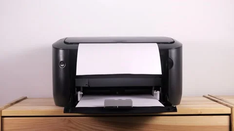 Office desktop laser printer printing single A4 letter page Video stock 65016336