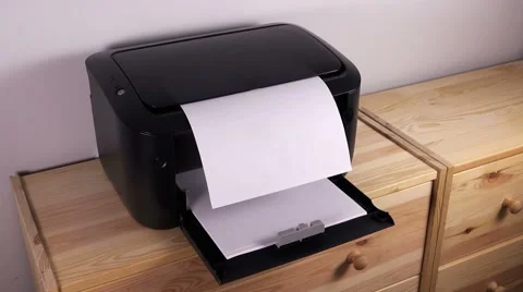Office desktop laser printer printing single A4 letter page Video stock 65016376
