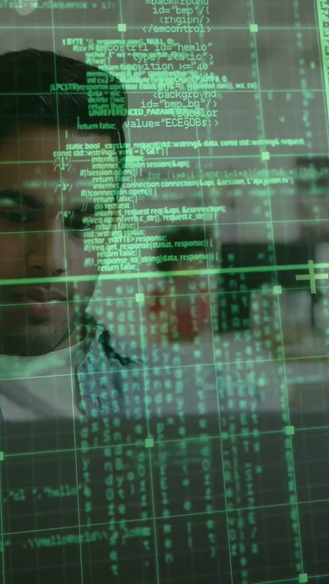 Office developer shifting gaze while green code grid scrolling and revealing Stock Footage 333079559
