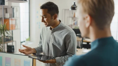 In the Office: Diverse Team of Mobile Software Developers Work on Desktop PC Stock Footage 112602290