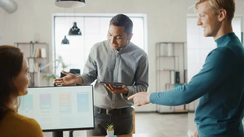 In the Office: Diverse Team of Mobile Software Developers Work on Desktop PC Stock Footage 112602397