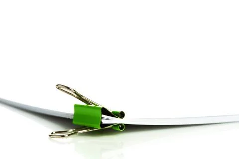 Office document with binder clip on white Stock Photos