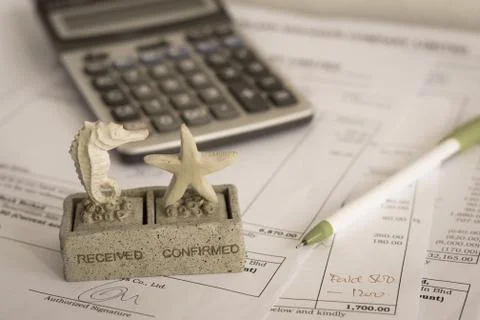 Office document with rubber stamp, pen and calculator Stock Photos