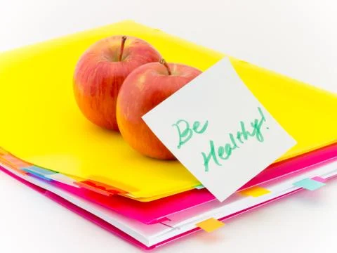 Office Documents and Apples; Be Healthy Stock Photos