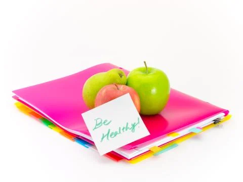 Office Documents and Apples; Be Healthy Stock Photos
