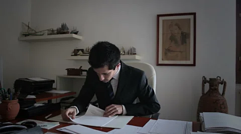 Office: Employee analyzes documents Stock Footage 54836766