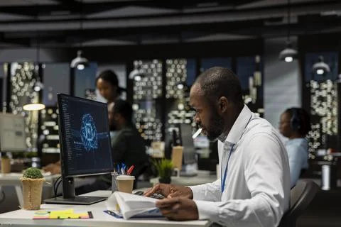 Office employee checking monthly data reports with AI analytics platform Fotos Stock