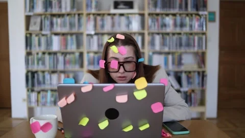 Office employee fights information overload surrounded by colorful sticky notes Stock-Footage 342178413