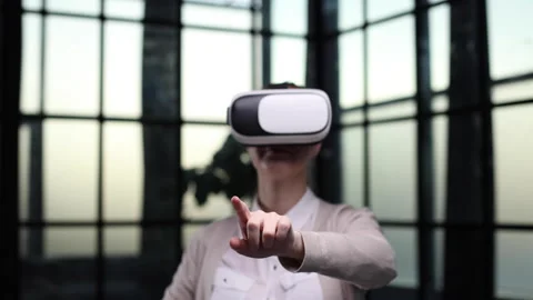 Office employee having fun at work, watching 3D video in virtual reality glasses Stock Footage 240415147