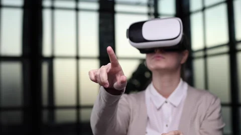 Office employee having fun at work, watching 3D video in virtual reality glasses Stock Footage 245713291