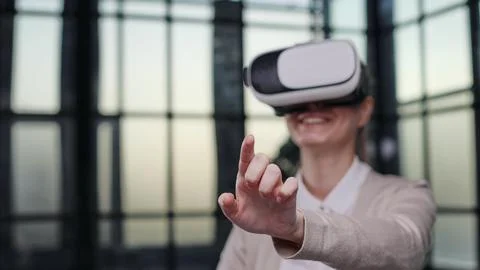 Office employee having fun at work, watching 3D video in virtual reality glasses Stock Photos