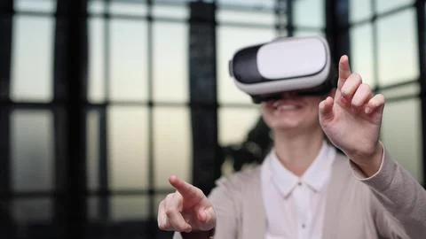 Office employee having fun at work, watching 3D video in virtual reality glasses Stock Photos