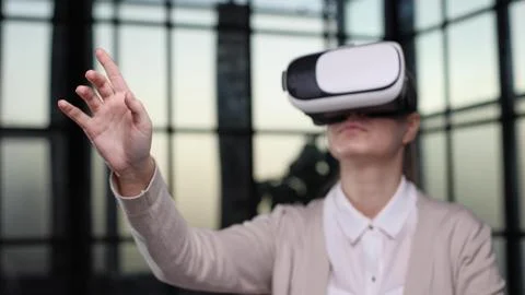 Office employee having fun at work, watching 3D video in virtual reality glasses Stock Photos