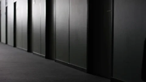 Office employee walking down corridor and turing to the left Stock Footage 78209401