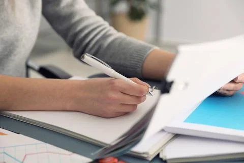 Office employee working with documents at table, closeup Stock Photos