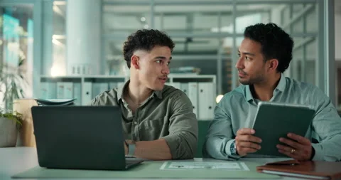 Office, employees and men with tech, discussion or programmer with laptop for Stock Footage 321399789