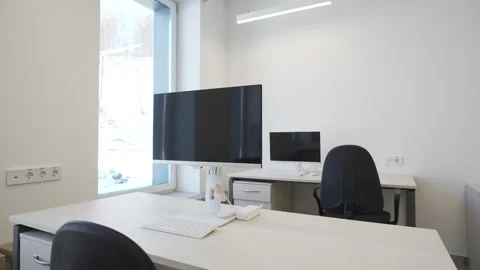Office filled with computers and desks shines with precision 動画素材 318866041