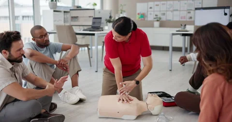 Office, first aid and training people in cpr, explain procedure and learning to Stock Footage 297169887