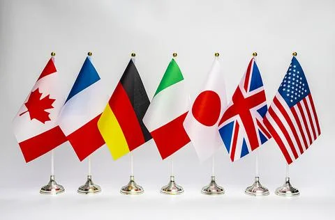Office flags of the countries of the G7 block on a light background. Summit o Stock Photos