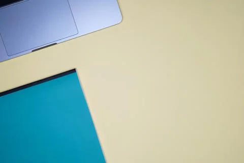 Office flat lay with pen, notebook, laptop placed on a light orange backgroun Stock Photos