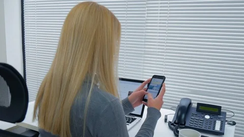 Office Girl chatting on her mobile phone Stock Footage