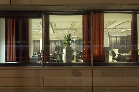 Office interior at night. Stock Photos
