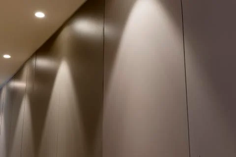 Office Interior Panel Wall with Overhead Lighting Stock Photos