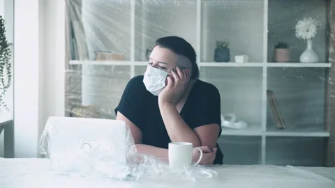 Office isolation remote job covid woman mask Stock Footage 157014642