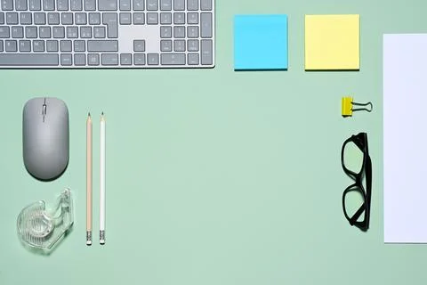 Office items on green background Stock Photos