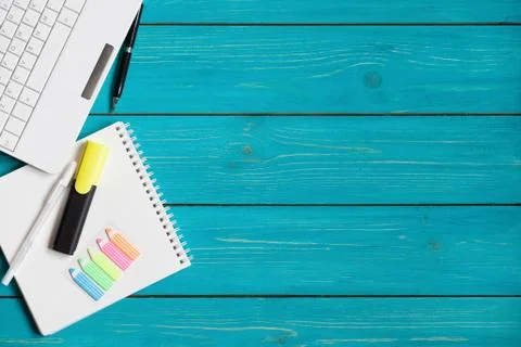 Office items on a turquoise table with space for your text Stock Photos