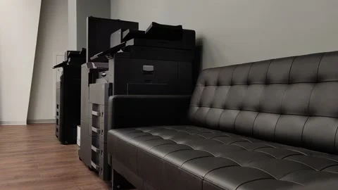Office large printer 3 in one. multiplying equipment next to the leather sofa Stock Footage 158634224