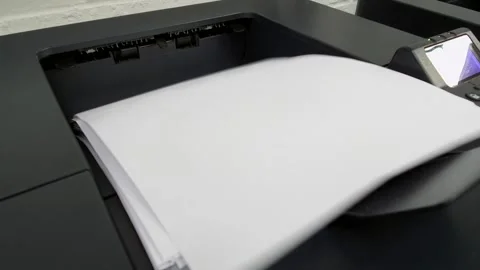 Office laser jet printer printing lots of paper Stock Footage 140996373