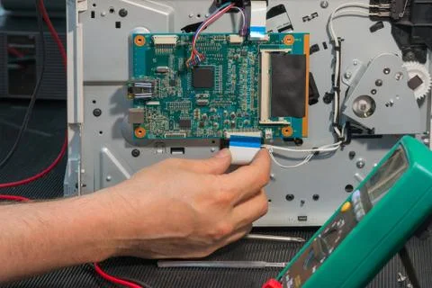 Office laser printer diagnostics and repair, disassembly circuit board in ser Stock Photos