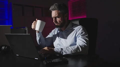 Office late man overworked in office overtime night solving laptop problem busy Stock Footage 346709848