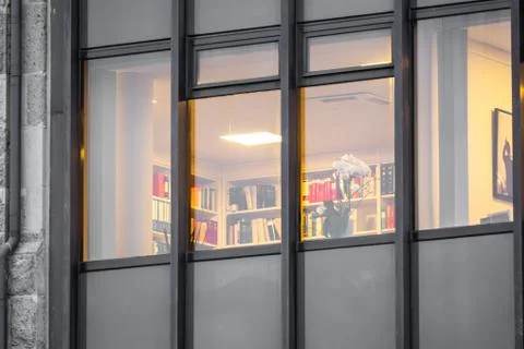 An office lights up in a building after work Stock Photos