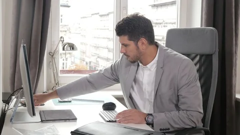 Office Man finished his work, stands up from a Table going Home Stock Footage 93944058