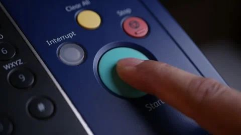 Office man press start button to using the Office printer for document printing. Stock Footage 306516761