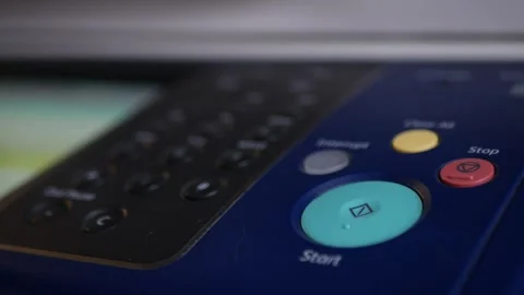 Office man press start button to using the Office printer for document printing. Stock Footage 306516763
