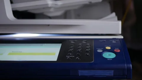 Office man press start button to using the Office printer for document printing. Stock Footage 306516775