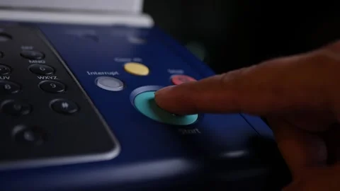 Office man press start button to using the Office printer for document printing. Stock Footage 306575255