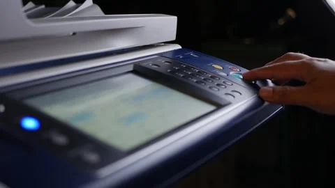 Office man press start button to using the Office printer for document printing. Stock Footage 308056140