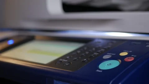 Office man press start button to using the Office printer for document printing. Stock Footage 308056144