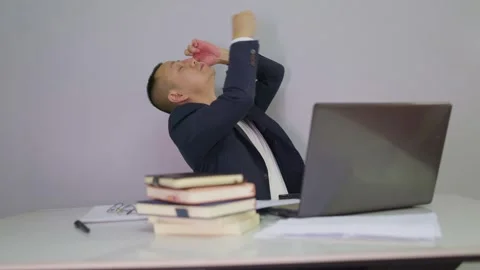 Office man putting eye drops in his eyes in front of computer Stock Footage 320094125