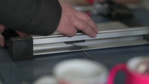 Office man using manual paper cutter or paper trimmer tool cutting white paper Stock Footage 168936270