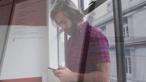 In office, man using smartphone with programming code and animation overlay Stock Footage 304861321