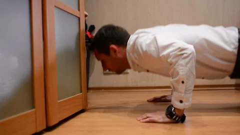 Office manager doing push-ups in at home Stock-Footage 91186631